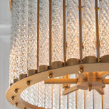 Close-up of the Cliffdale 6 Light Pendant in matt gold, showing twisted clear glass rods encircled by a gold ring with visible lamp holders and fixings.