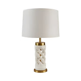 The Iverne 1 Light Twisted Carved Alabaster Table Lamp in brass and soft white features a twisted alabaster base, gold accents, and a large white fabric shade, shown against a plain white background.
