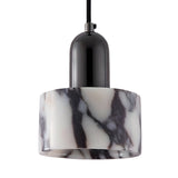 The Orvani 1 Light Veined Marble Single Pendant Light features a glossy black fitting and a white, dark-veined marble-patterned shade, elegantly suspended from a sleek black cord for a striking sculptural statement.