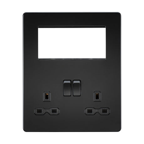 Introducing the Small Multimedia Combination Plate in Matt Black with a black insert, featuring a seamless design. This sophisticated double electrical wall socket includes two rectangular switches alongside two sets of three-pin plug sockets. The screwless plate also offers a large rectangular opening above the switches, perfect for USB charging or adding modular inserts.