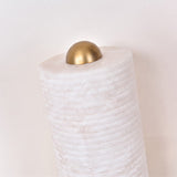 Close-up of the Aurelior Small ribbed alabaster table lamp's domed brass cap atop the horizontally ribbed white stone column, set against a plain light background.