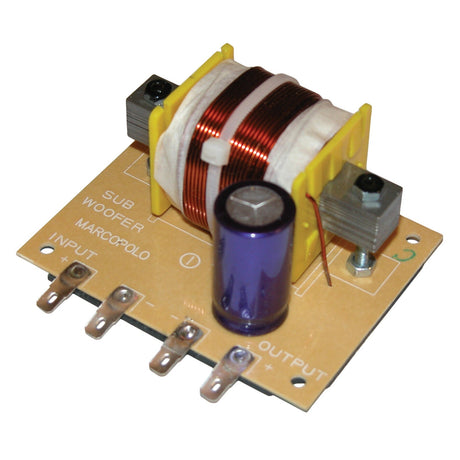 The QTX Subwoofer Filter, 12db, 120hz, 4 Ohms - 600W is an electronic circuit board equipped with a copper coil and a large purple capacitor, featuring labeled terminals for input and output. It is designed for use with loudspeaker systems to handle crossover frequency adjustments as specified by the printed text.