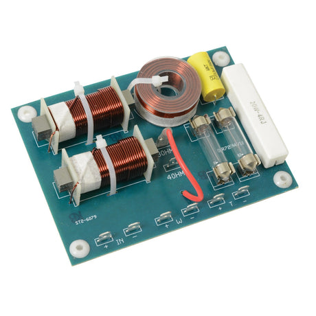 The QTX 2-Way Crossover 12db, 4/8 Ohm - 200W, 2khz is a green circuit board equipped with high-quality components, such as copper wire coils, resistors, capacitors, and connectors. It features symbols and text that indicate component types and connections to ensure excellent sound reproduction through its integrated 2-way crossovers.