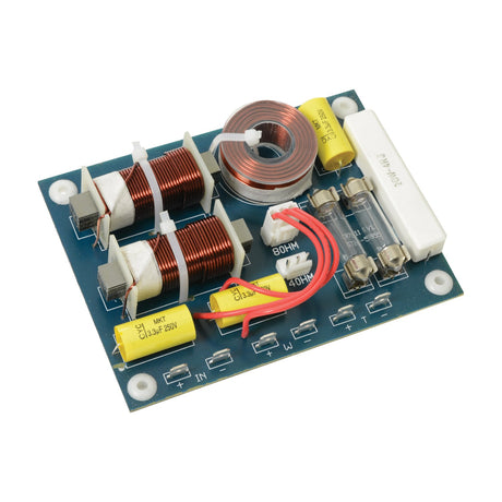 QTX X48R3KH 2-way crossover board with copper coils, yellow capacitors, fuse holder, and screw terminals, shown on a plain white background.