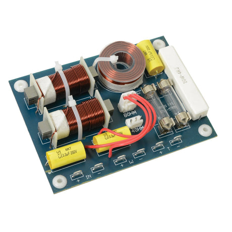 The QTX 2-Way Crossover 12db, 4/8 Ohm - 200W, 3khz is a crossover circuit board incorporating coils, capacitors, and resistors. It is commonly used in audio systems to enhance sound quality by dividing frequencies for speakers. The components are arranged on a blue board with clearly labeled input and output connection points.