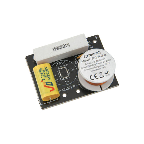 QTX compact passive crossover network board with ceramic resistor, yellow capacitor, copper inductor coil and input terminals on a plain white background.