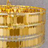 Close-up of the Brackhurst 5 Light Pendant in gold, showing layered rows of small hexagonal gold-plated metal tiles creating a shimmering cascade effect.