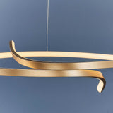 Endon Chartmont pendant light in matt brushed gold, close-up of the looped ring form with frosted LED diffuser against a deep blue wall.