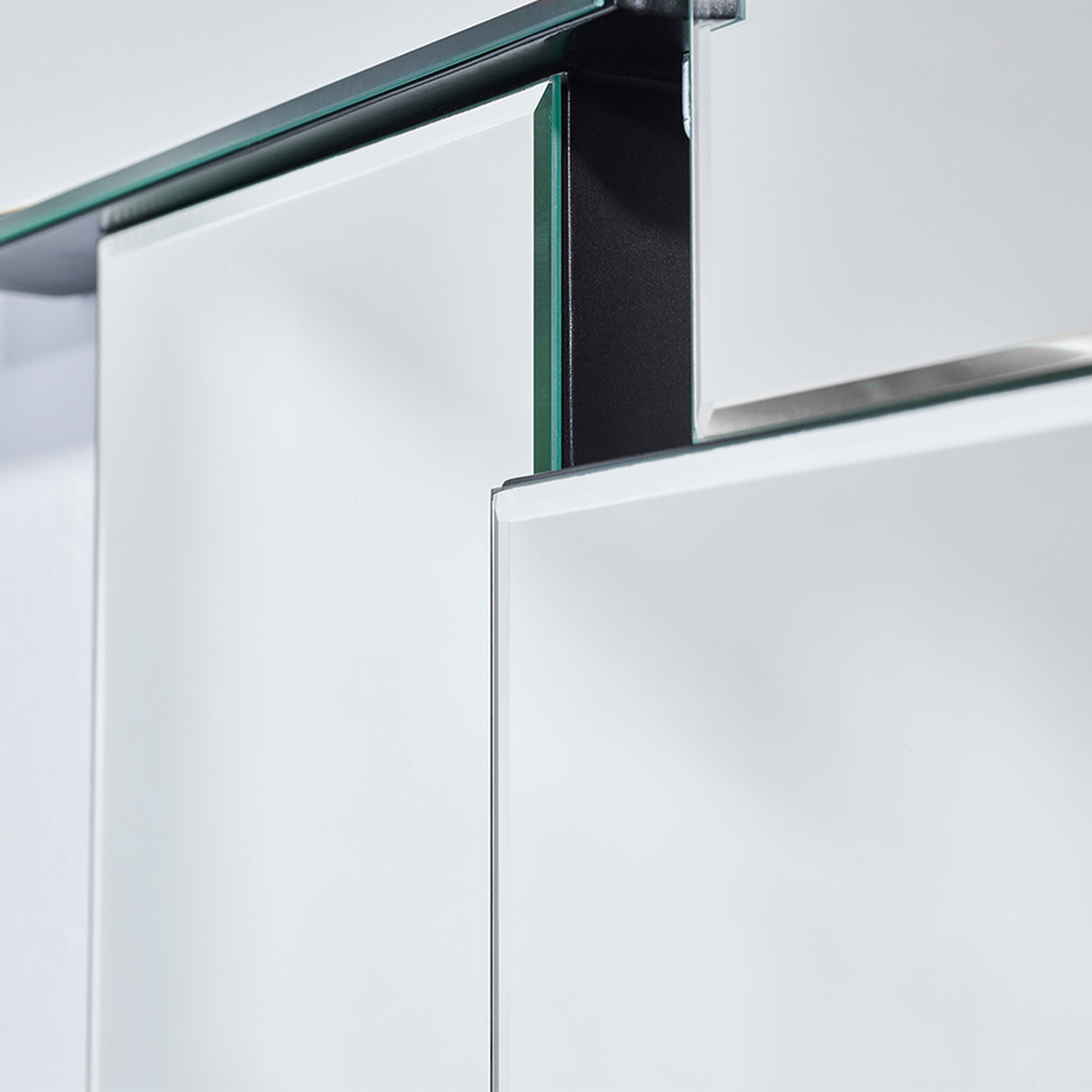 Close-up of two overlapping panel edges, one standing noticeably further forward from the wall than the other.
