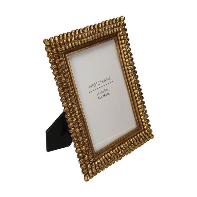 Libra Interiors Textured Beaded Gold Photo Frame with ornate raised resin border, clear glass front, and fold-out easel back, shown on a white background.