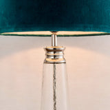 Close-up of Endon Danehurst table lamp showing hammered clear glass base with tiered nickel collar and teal velvet shade with silver lining.