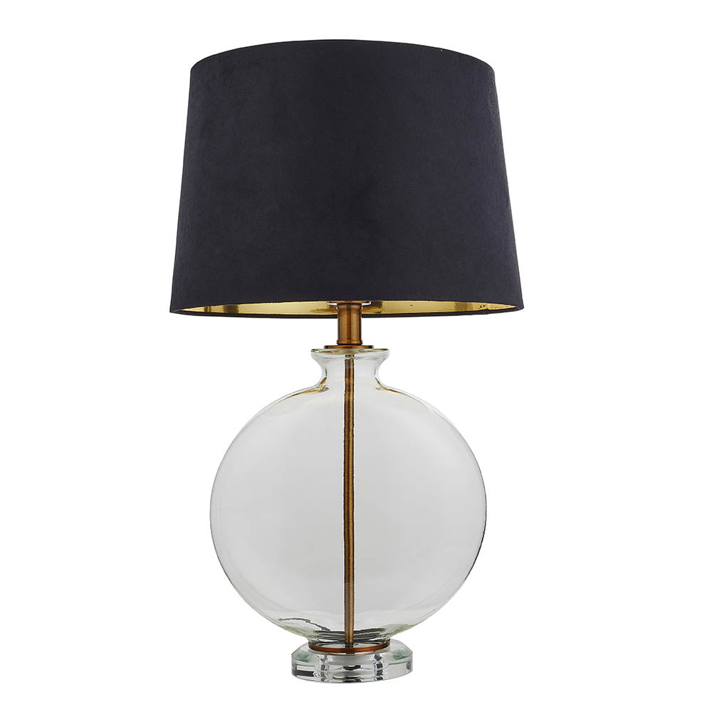 Endon Bramleigh table lamp with a clear glass ellipsoid base, antique brass stem and black tapered shade with gold-toned interior, on a white background.