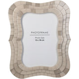 Libra Interiors Mosaic Tiled Resin Photo Frame in ivory with a scalloped wave-shaped surround and layered tile texture, holding a 13x18cm portrait image.