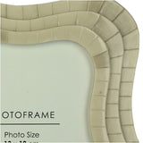 Close-up of the Libra Interiors Mosaic Tiled Resin Photo Frame in ivory, showing the wave-shaped border with layered tile texture around a 13x18cm aperture.