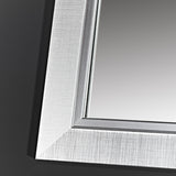 Close-up of the Bremen Silver full length mirror's corner, showing a stepped moulded frame with a brushed silver finish over a darker ground.