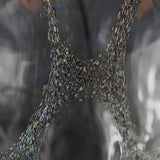 Close-up of the Endon Brenstead table lamp base showing textured charcoal-tinted artisan glass with a bubbled, hand-made finish.