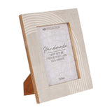 Libra Interiors Arched Line mango wood photo frame in cream with curved and straight line patterns on the border, easel back, holding a 13x18cm portrait photo.