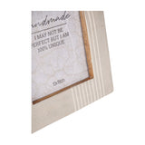 Close-up of the Libra Interiors Arched Line mango wood photo frame in cream, showing striped border detail and exposed wood inner edge.