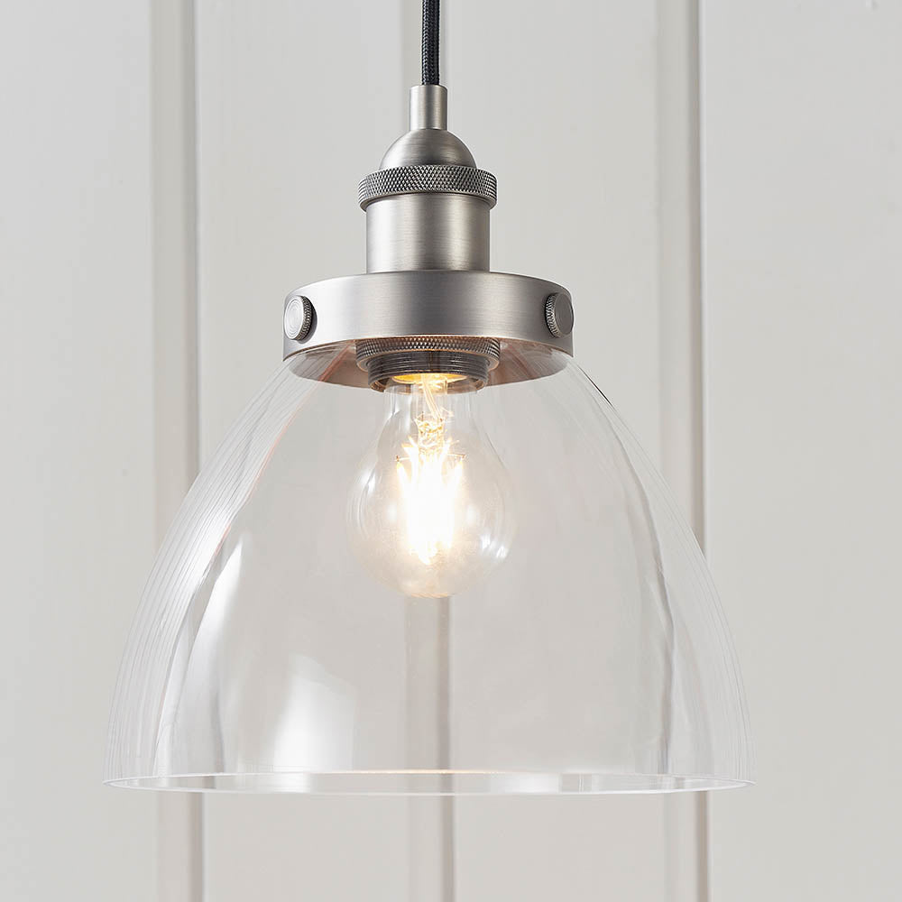 Wentworth Pendant Light in silver with clear glass dome shade, knurled metal lamp holder, and exposed filament bulb.