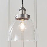Wentworth Pendant Light in silver with clear glass dome shade, knurled metal lamp holder, and exposed filament bulb.