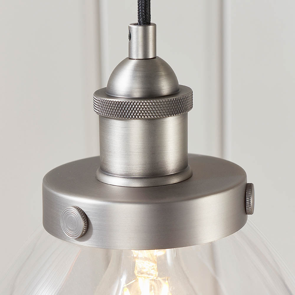 Wentworth Pendant Light in silver, close-up of the knurled lamp holder and E27 fitting above a clear glass shade, on a plain light background.