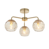 Endon Everly 3 light semi-flush ceiling light in gold with brass frame and three dimpled glass globe shades on curved arms.