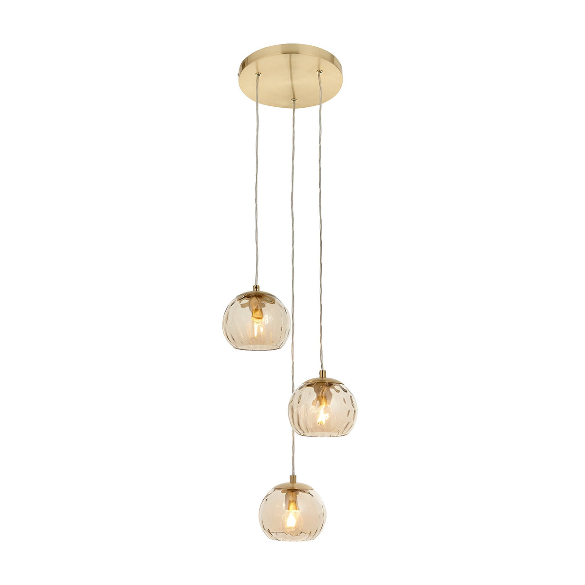 Draycott 3-light cluster pendant with round satin brass ceiling plate and three dimpled champagne glass globe shades on cables, shown on a white background.