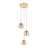 Draycott 3-Light Dimpled Glass Pendant in Satin Brass with round ceiling rose and three cascading champagne-tone globe shades on brass cables.