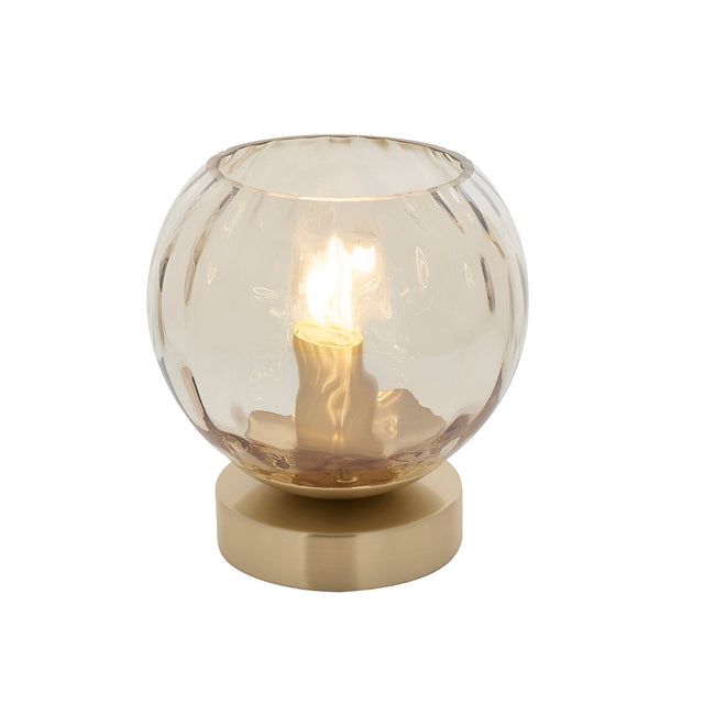 Draycott Dimpled Glass Table Lamp with champagne-tinted spherical shade on a satin gold base, single E14 bulb lit, shown on a plain white background.