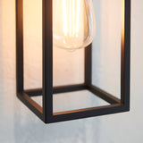 Close-up of the Brenford Outdoor Wall Light in black, showing its open aluminium cage frame and exposed filament bulb, IP44 rated.
