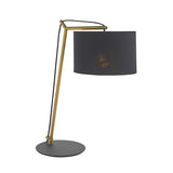Endon Carlfield cantilevered table lamp with matt brass arm, black cotton drum shade and matt black round base, shown on a plain background.