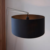 Carlfield Floor Lamp in matt nickel with a cantilevered arm and large black cotton drum shade, set against a plain light background.