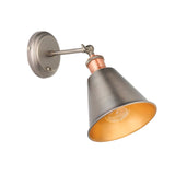 Endon Brackley industrial wall light with adjustable conical shade in aged pewter and antique copper, toggle switch and E27 filament bulb, on white.