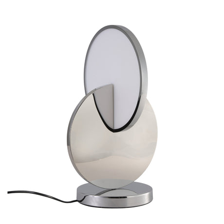 The Half Moon LED Table Lamp - Silver features a modern design with interlocking circular shapes—one metallic silver, one white—set on a chrome base and finished with a sleek black power cord.