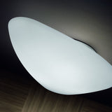 Stone LED Outdoor Flush Ceiling Light in white, pebble-shaped diffuser mounted flush to the ceiling, glowing evenly with no visible frame.