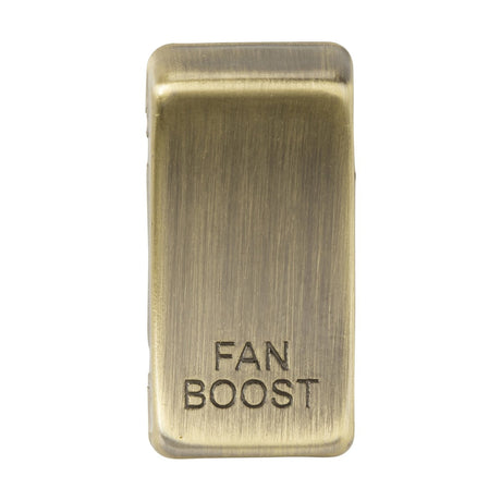 The Switch Cover "Marked FAN BOOST" in antique brass features a rectangular design with a brushed metallic texture. Made from durable ABS construction, it combines elegance with robust functionality.