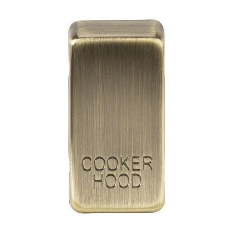 The Switch Cover "Marked COOKER HOOD" in antique brass boasts a rectangular design with a smooth finish and is constructed from durable ABS material.