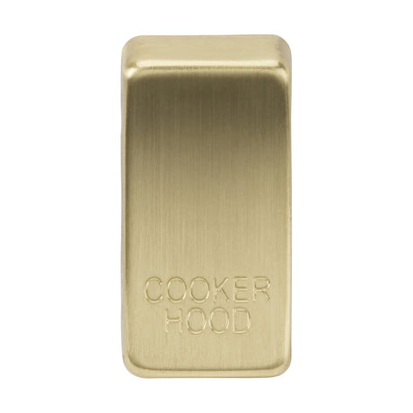 A rectangular Switch Cover marked "COOKER HOOD" in brushed brass, featuring a gleaming metallic gold surface with a refined finish that exudes an elegance reminiscent of classic automobile rocker covers.