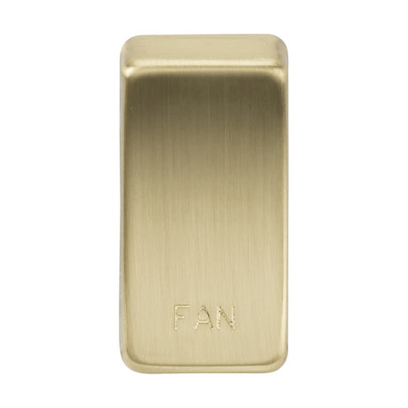 A rectangular rocker cover switch plate featuring brushed brass with rounded edges, engraved with "Marked FAN" at the bottom center.