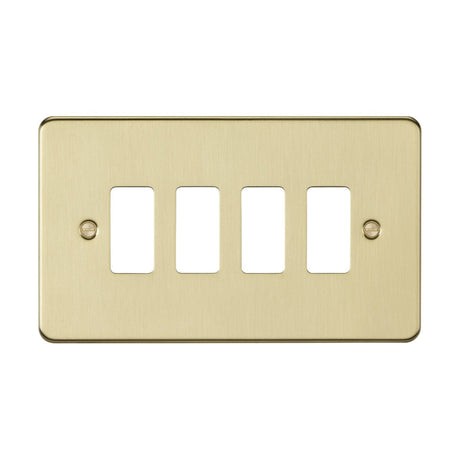 The 4 Gang Grid Faceplate - Brushed Brass boasts a brushed brass finish with four switch openings and two screw holes, one on each side. Designed with precision, its sleek design adds a modern flair to any space.