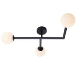 Endon Kelham 3 light semi-flush bathroom ceiling light in black with three white glass globe shades on angled arms, shown on a plain background.