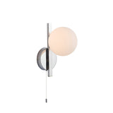Endon Kelham bathroom wall light in chrome with a matt opal glass sphere set in a geometric frame and pull-cord switch, on a plain white background.