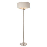 Brenley 3 Light Floor Lamp in brushed chrome with a wide linen drum shade and slim stem base, shown on a plain white background.