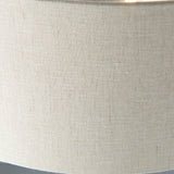 Close-up of the natural linen fabric shade on the Brenley 3 Light Floor Lamp, showing woven texture and brushed chrome trim edge.