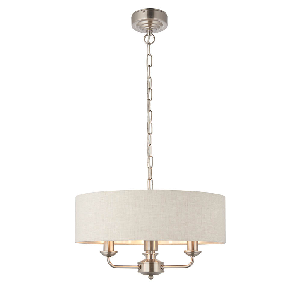 Brenley 3 Light Pendant in white and chrome with a round linen drum shade, three candle-style arms, chain-hung from a chrome ceiling mount.