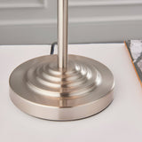 Close-up of the brushed chrome circular tiered base of the Endon Brenley 3 Light Table Lamp on a white surface.