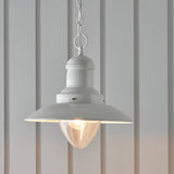 Endon Chartford cream gloss pendant light with shaped clear glass shade and chain suspension, hanging against pale panelled walls.