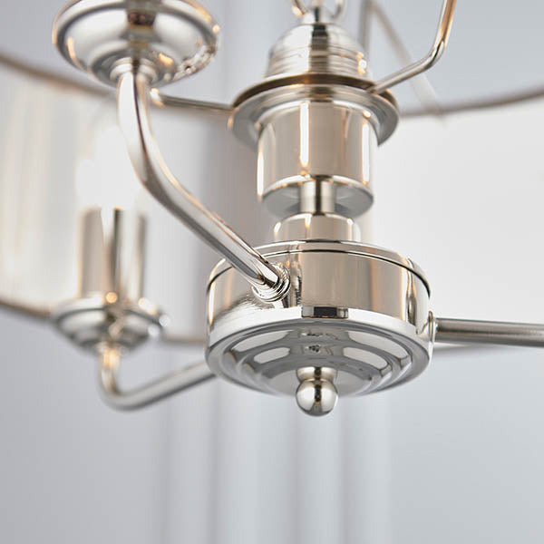 Close-up of the Endon Brenley V1 3 Light Pendant showing the polished nickel central fitting, curved arms, and chain suspension in bright silver finish.