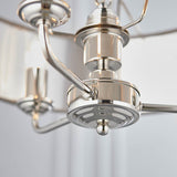 Close-up of the Endon Brenley V1 3 Light Pendant showing the polished nickel central fitting, curved arms, and chain suspension in bright silver finish.