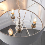 Endon Brenley V1 3 light pendant shown from below, with three E14 candle bulbs on nickel arms inside a grey linen shade with brushed metallic lining.